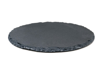 Natural black stone slate as a tray. Side view of slate board isolated on white