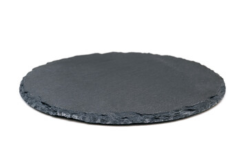 Natural black stone slate as a tray. Side view of slate board isolated on white
