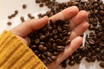 coffee beans in hand