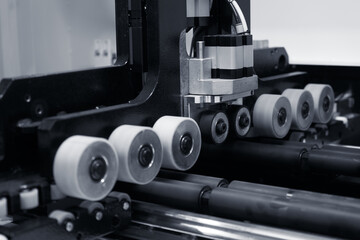 Fototapeta na wymiar The image of the feed rollers of a woodworking machine.