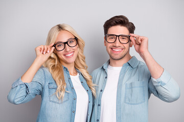 Portrait of attractive cheerful couple touching specs hugging isolated over gray pastel color background - obrazy, fototapety, plakaty