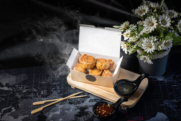 Hot Deep Fried Chicken Roll  on a black background.