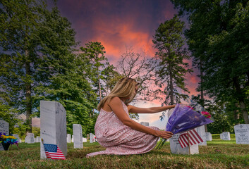 A Grieving Woman Shares Her Emotions With Her Fallen Veteran Family Member At A MIlitary Cemetery
