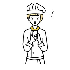 立ってスマートフォンを操作して何かに気づいて驚いた調理師の女性