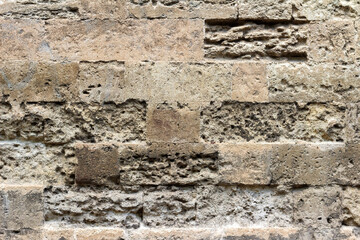 Photo texture of old and ancient stone wall.