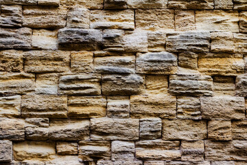 Photo texture of old and ancient stone wall.