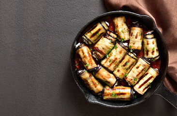 Eggplant (aubergine) rolls with cheese and greens
