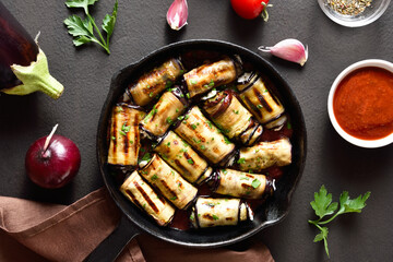 Eggplant (aubergine) rolls with cheese and greens