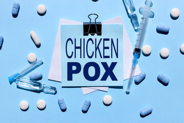 Chickenpox. blue background concept of medicine. pills. syringe