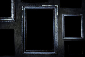 Scary horror haunted black picture frames on grunge dirty abandoned house wall. - obrazy, fototapety, plakaty