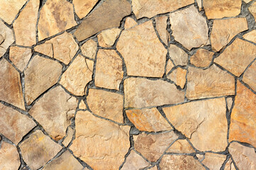 Photo texture of brown colored stone wall tile.