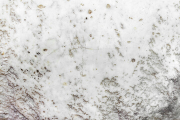Close-up photo texture of worn marble wall.