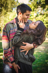 Fototapeta premium Cheerful and romantic couple hugging and enjoying in in love