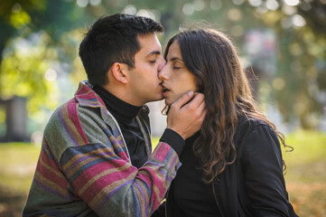 Close-up of French kiss. Couple in love hugging and kissing