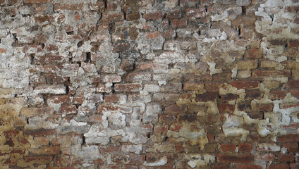 the worn brown brick wall. the obsolete wall for grunge background texture. aged texture for creative street design elements.