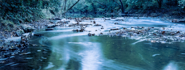 Rapids on Tates creek passing through Veteran's park in Lexington, Kentucky during early spring