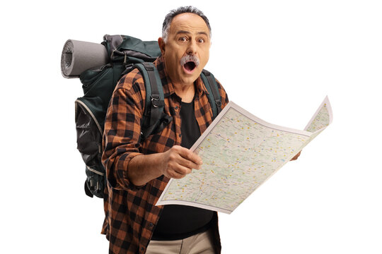 Surprised mature hiker holding a map and looking at camera