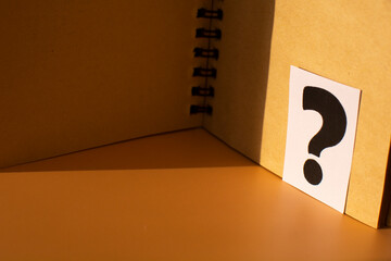 a question mark in the diary. Frequently Asked Questions, Answers, and Brainstorming Concepts