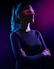 Gordijnen Concept of future technology or entertainment system, virtual reality. Female portrait lit by HUD interface © konradbak