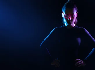 Foto op Plexiglas Concept of future technology or entertainment system, virtual reality. Female portrait lit by HUD interface © konradbak