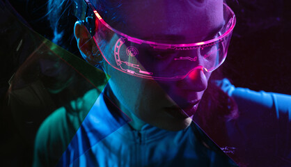 Concept of future technology or entertainment system, virtual reality. Female portrait lit by HUD interface
