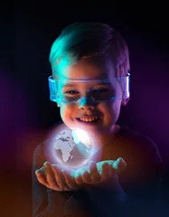 Poster Cute little boy using digital glasses. sci-fi, earth awareness, future mind controlling concept © konradbak