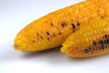 Grilled sweet corn on white background, isolated