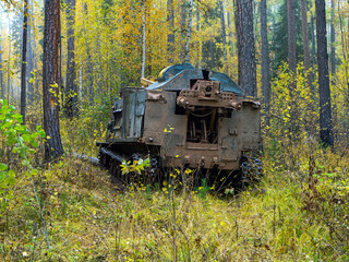 Drilling rig on a tracked chassis in the forest. Machine for exploration geological drilling