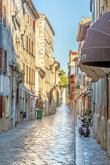 Image of the historical center of the Croatian coastal town of Porec in the morning light during the sunrise