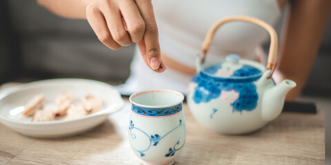 Asian woman person relaxing with hot tea to drink at home, tea cup for happy lifestyle in morning