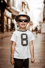 Gordijnen Smiling boy exploer Spanish city © konradbak