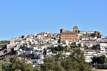 Fototapeta na wymiar View of the church Nuestra Señora de los Remedios (16th century) in the Granada town of Iznalloz (Spain)