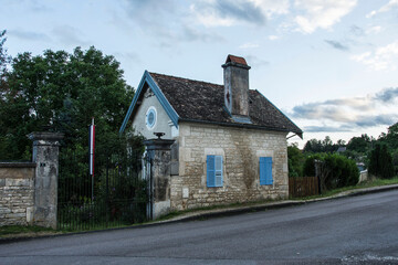 Fototapeta na wymiar traditional old stone garden shed near the village of Arc en Barroix in the french Champagne Ardenne in the evening