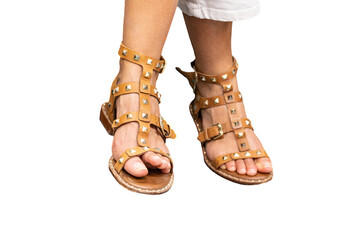 Feet of a woman with sandals isolated on white background