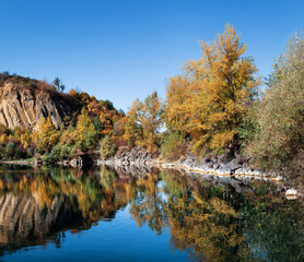 Old flooded quarry in autumn