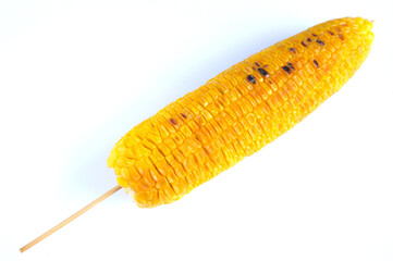 grilled sweet corn arranged vertically on white background, isolated 
