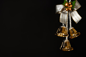 Fototapeta na wymiar Festive New year Christmas bell on black background