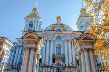 Fototapeta na wymiar Autumn Petersburg. St. Nicholas Cathedral and Autumn Foliage in St. Petersburg, Russia
