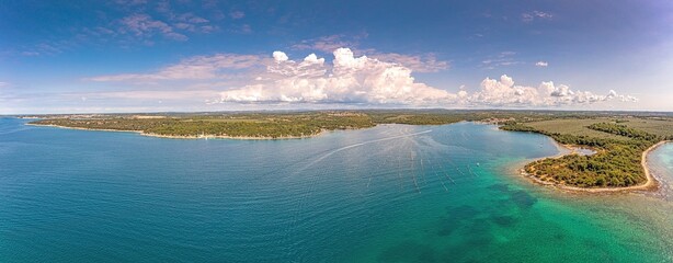 Obraz premium Drone panorama over Porto Busola peninsula near Porec in Croatia during daytime