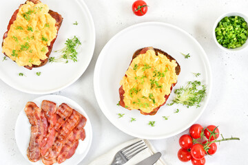 Scrambled eggs with microgreen on bread