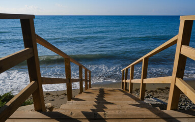 Wooden stairs leading down to the sea