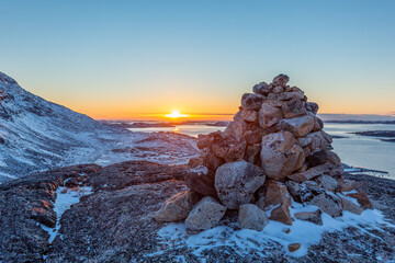 Polar arctic greenlandic sunset over the Nuuk fjord and stone pyramid, Nuuk, Greenland