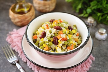 Stewed rice with green peas, carrots, corn and beans.