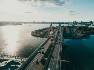 A top view of the Millennium Bridge in Kazan . Cable-stayed bridge across the river. Sunset Beams.