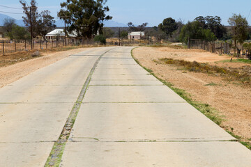 Concrete road in poor condition between Oudtshoorn and Ladysmith, South Africa