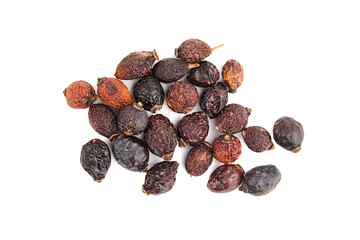 Dried rose hip fruits herbal tea isolated on white