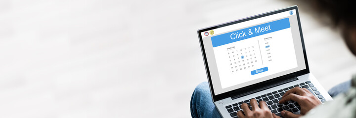 Young Man Using Laptop At Home