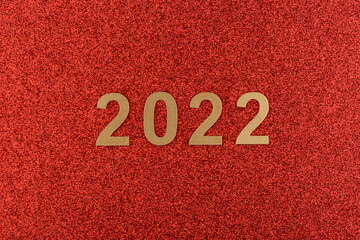 Números de año nuevo de 2022 sobre fondo rojo