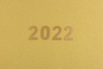 Números de año nuevo de 2022 sobre fondo dorado