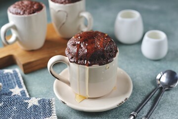 Chocolate mugcake cooked in a microwave with honey